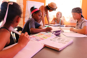 KAYEC kids work on their maths with Youth Officer Riana Gaoes, November 2015.