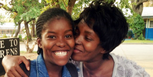 At the FNB sponsorship launch, school principal Viviana Seponde (right) testified to KAYEC’s impact on children including her own daughter, Maria (left).