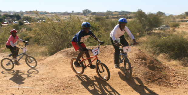 The 14-and-under boys negotiate the berms.